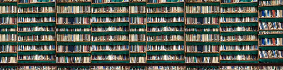 academic associations: stacks of books in a research library
