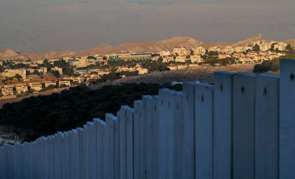 View of Israeli Maale Adumim Settlement taken from behind apartheid wall in occupied East Jerusalem. Settlement is surrounded by spacious tract of land.
