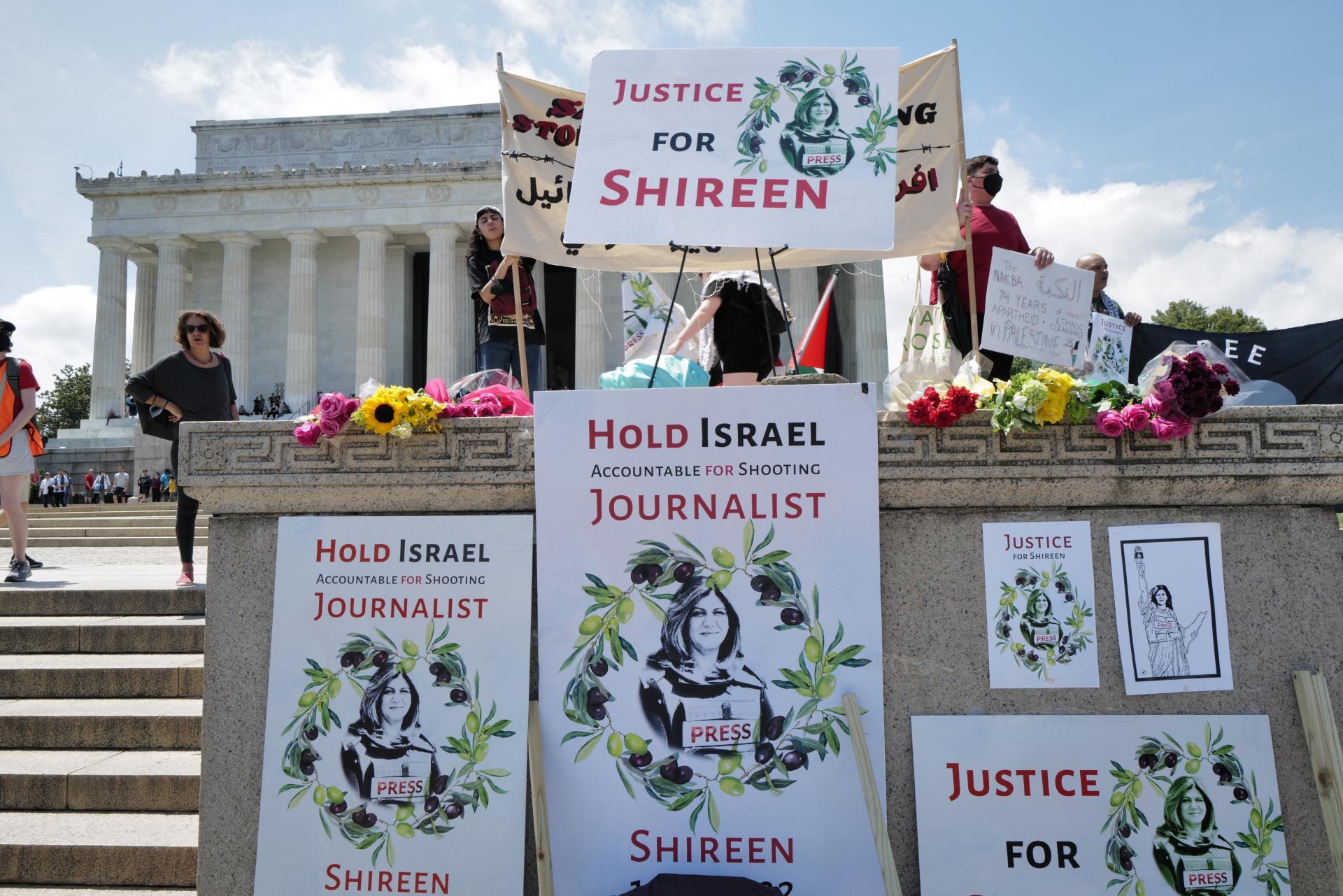 Nakba commemoration at the Lincoln Memorial pays tribute to Shireen Abu Akleh, with flowers and signs that read "Justice for Shireen" and "Hold Israel Accountable for Shooting Journalist Shireen."