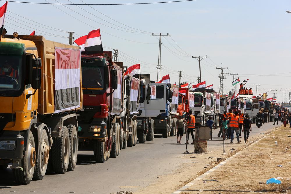 Egyptian construction vehicles and equipment arrive in the Gaza Strip, vehicles are adorned with Egyptian flags. May 2021.