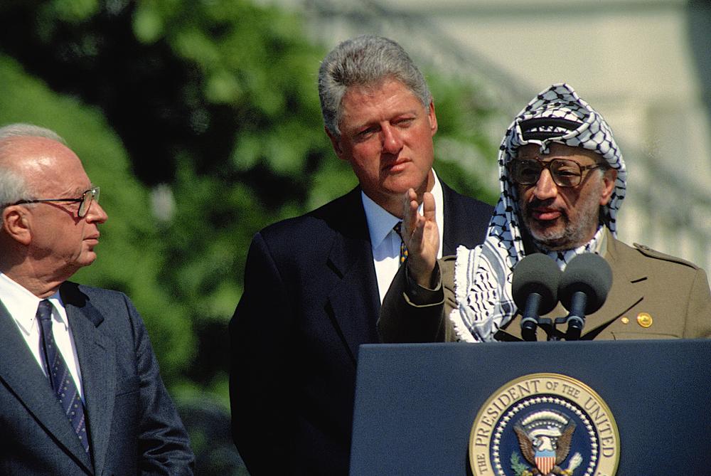 PLO Chairman Yasser Arafat speaks at a press conference on the White House Lawn alongside US President Bill Clinton and Israeli Prime Minister Yitzhak Rabin.