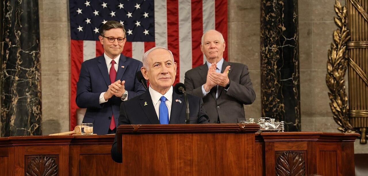 Netanyahu addresses a joint session of Congress. Behind him: Speaker of the House Mike Johnson, who presided over the session, and Senator Ben Cardin representing the Senate.