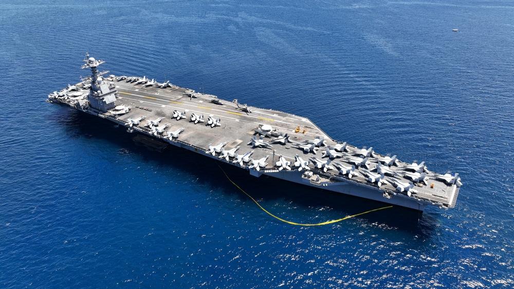 Aerial view of USS Gerald R. Ford aircraft carrier at sea.