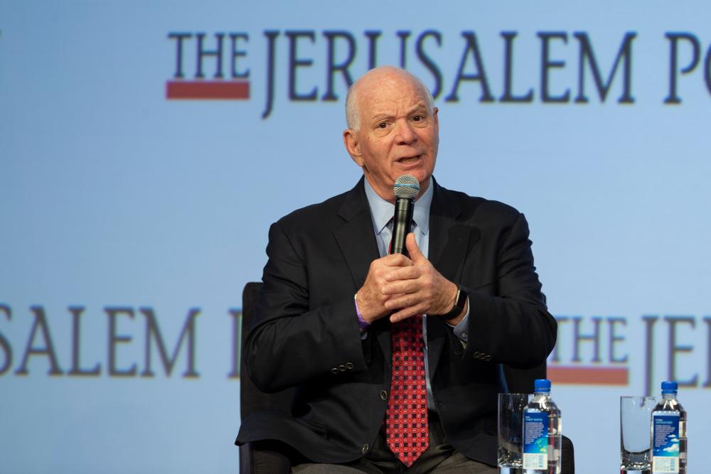 US Senator Ben Cardin speaks at an event hosted by the Jerusalem Post, their logo is displayed on the backdrop. April 2018.