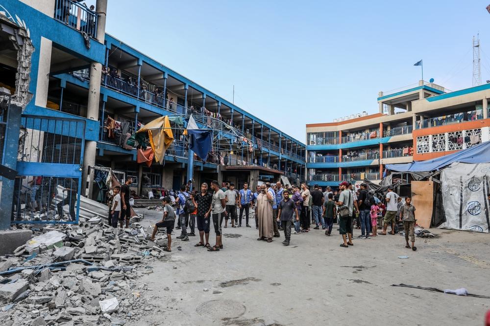 Palestinians inspect the damage to an UNRWA school in the Nuseirat refugee camp, where many displaced Palestinians sought shelter due to Israel's genocide in Gaza. July 15, 2024.