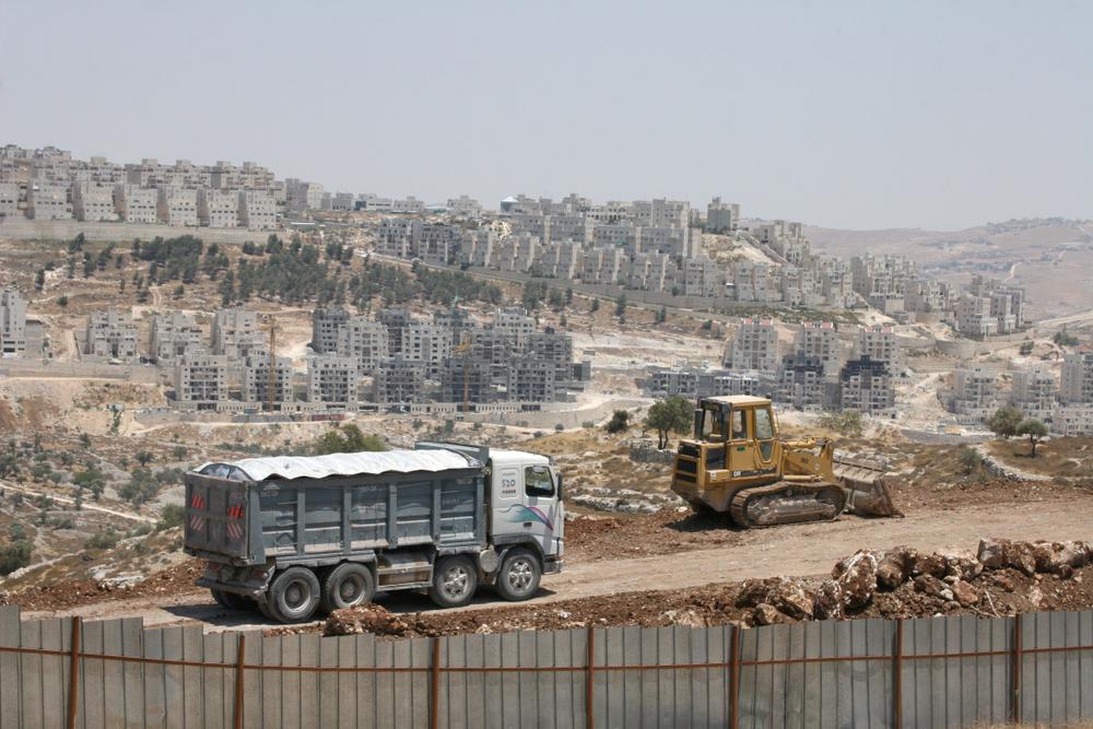 Israeli construction vehicles move through the infamous Maale Adumim settlement in the West Bank.