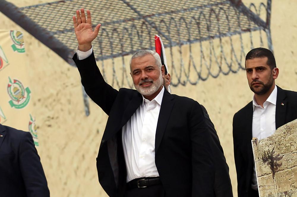 Head of the Hamas Political Bureau, Ismail Haniyeh, greets a crowd at a public appearance in Gaza City.