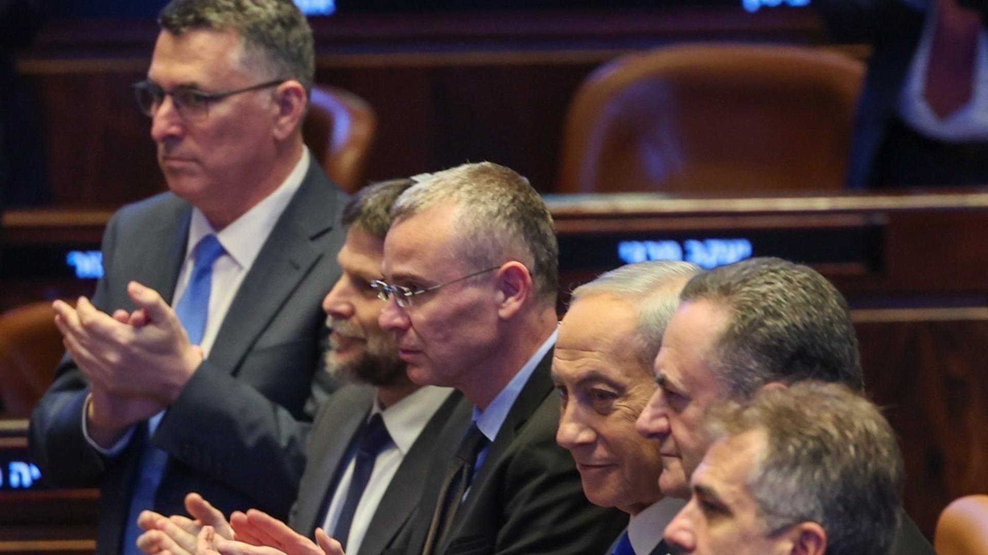 Benjamin Netanyahu, Yariv Levin, Bezalel Smotrich, Gideon Sa'ar and other key officials attend a speech at the Knesset.
