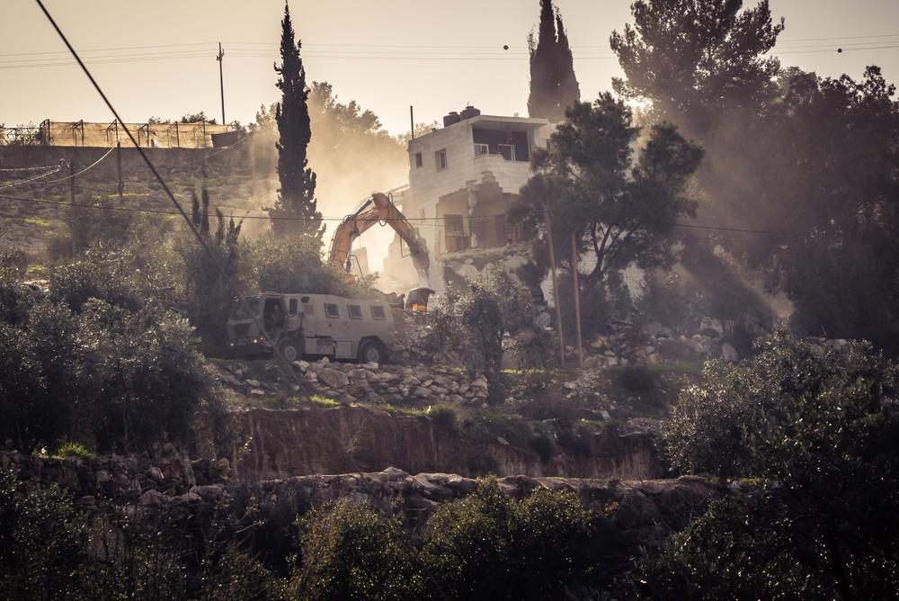 IDF soldiers destroy a Palestinian home in the Hebron district of the West Bank.