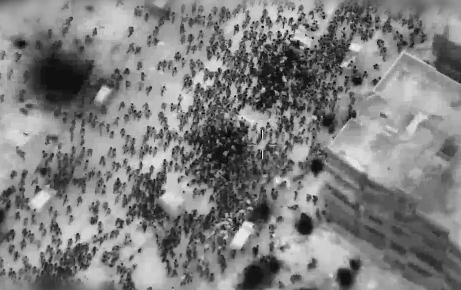 Screenshot of Israel's aerial targeting of a large crowd of Palestinians waiting to receive aid in Gaza City on February 29, 2024.