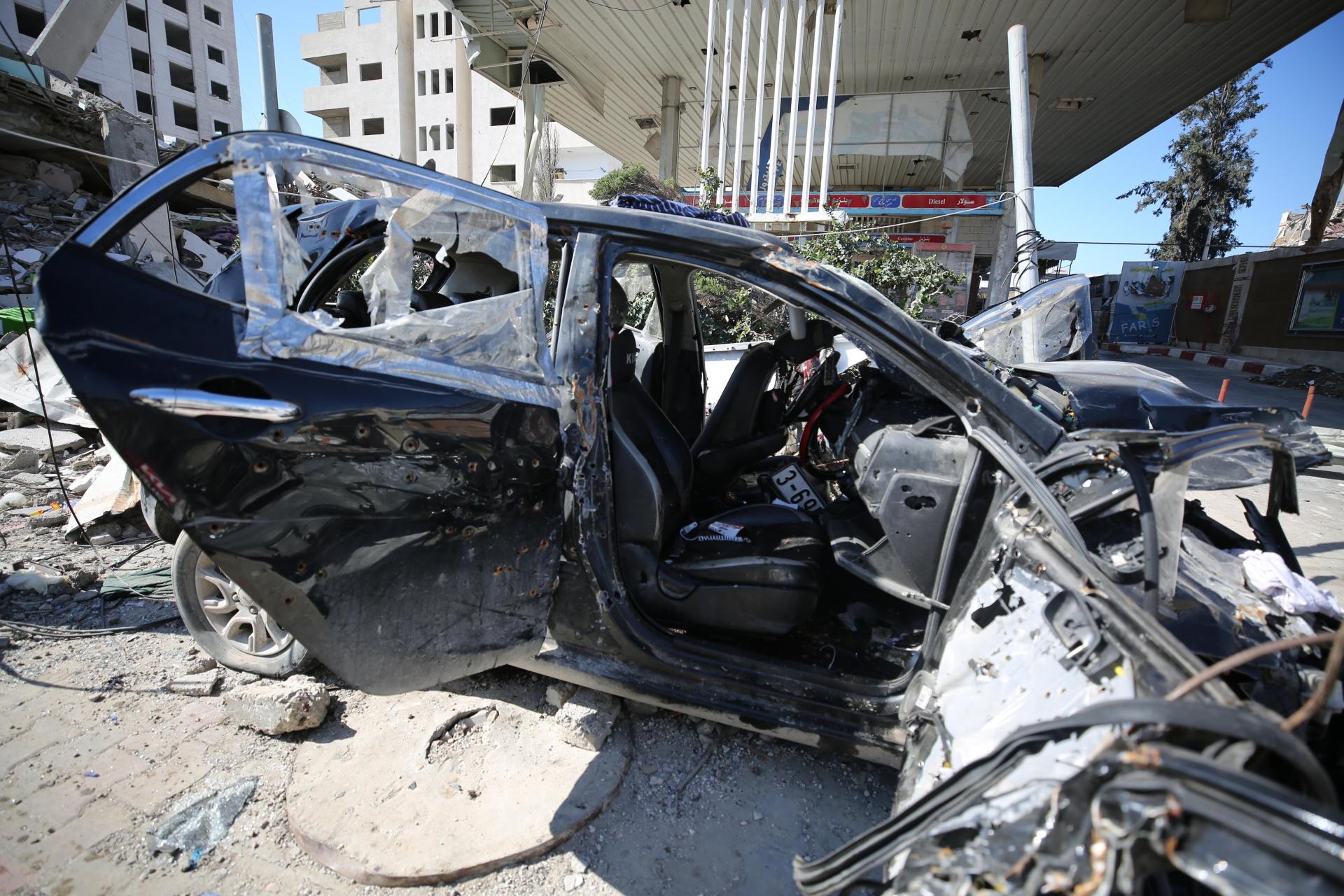 The destroyed car in which Hind Rajab and her relatives were killed. The vehicle shows damage from Israeli tank shelling and 300 bullet holes.