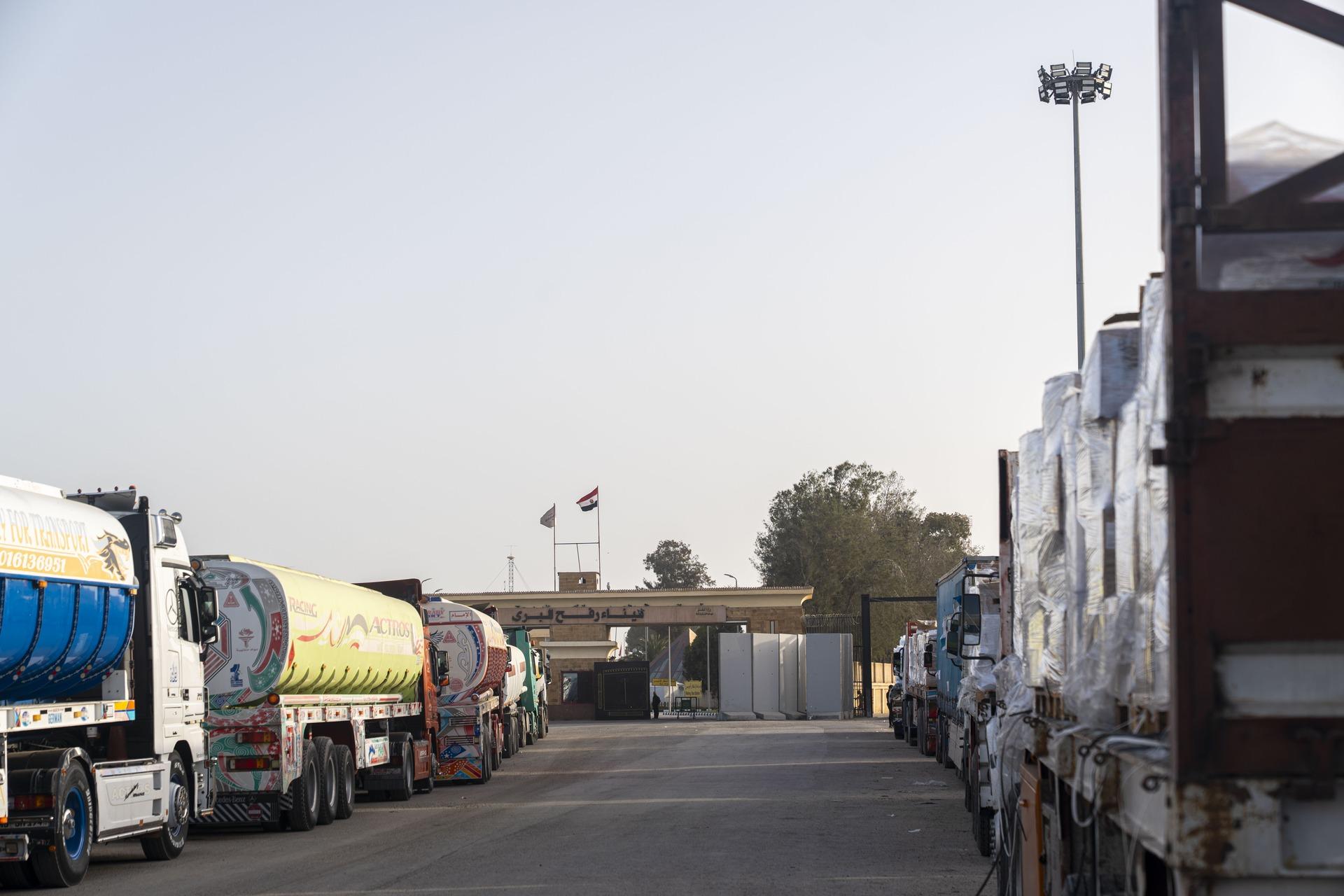 Humanitarian aid trucks wait for Israeli approval to enter the Gaza Strip on the Egyptian side of the Rafah Crossing.