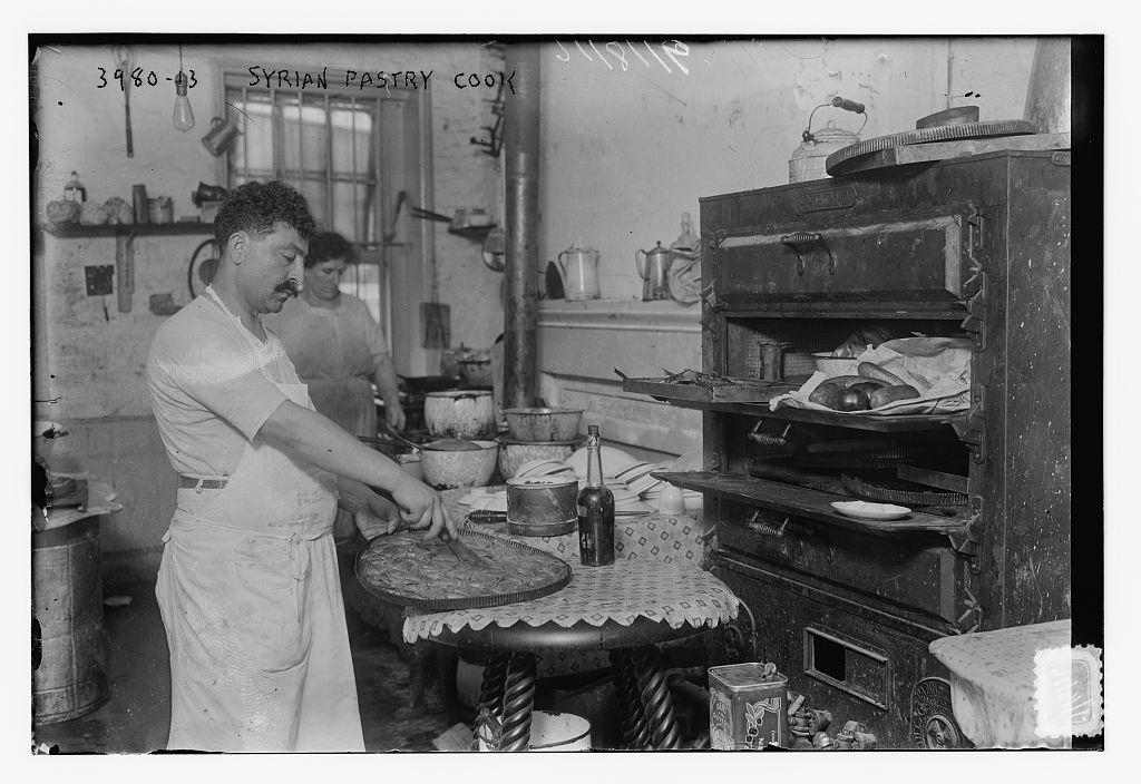 A Syrian baker makes baklava at his shop in Little Syria, Manhattan, New York.