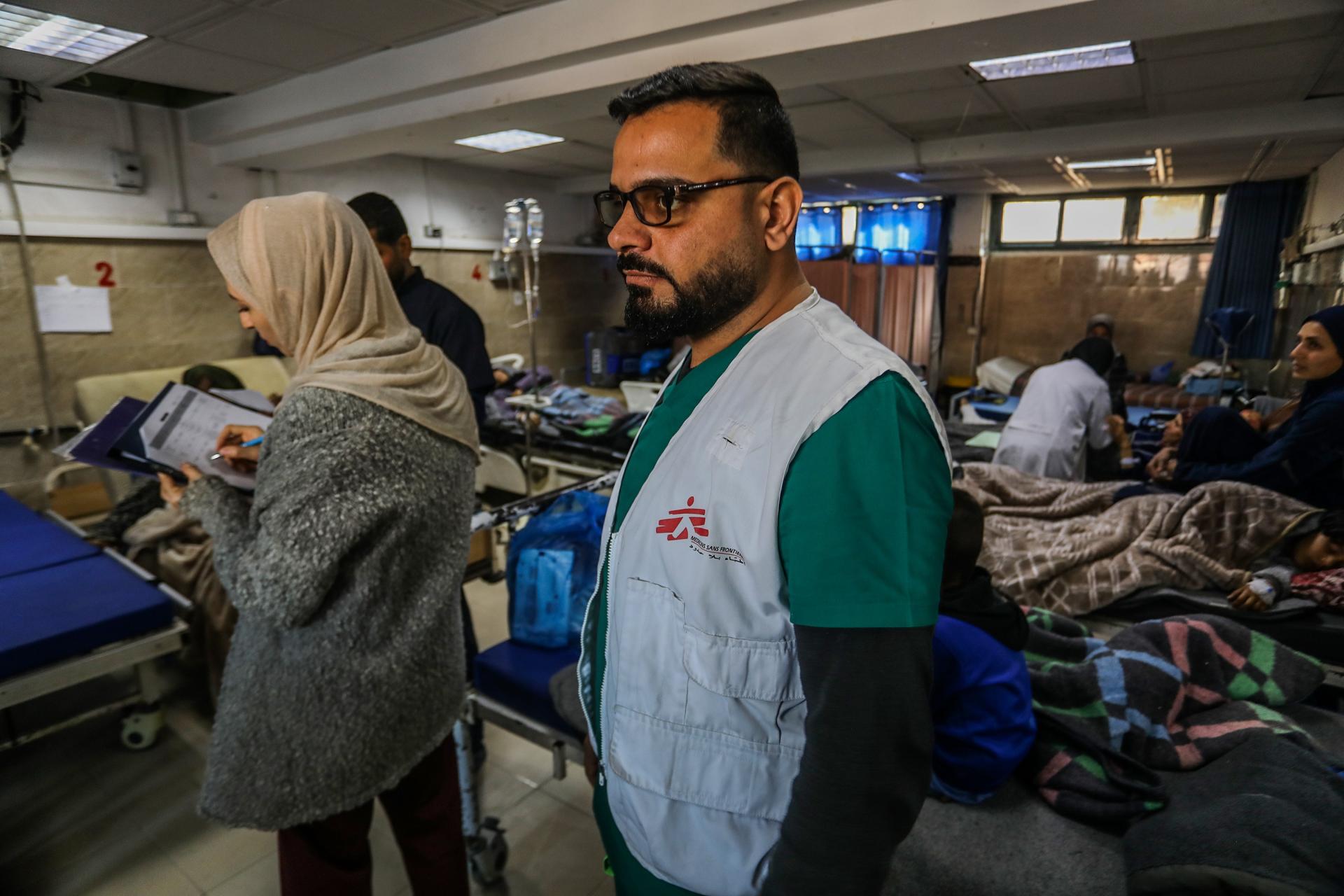 A MSF doctor and medical team struggle to treat patients in a crowded ER amid inadequate entry of supplies and medical aid.