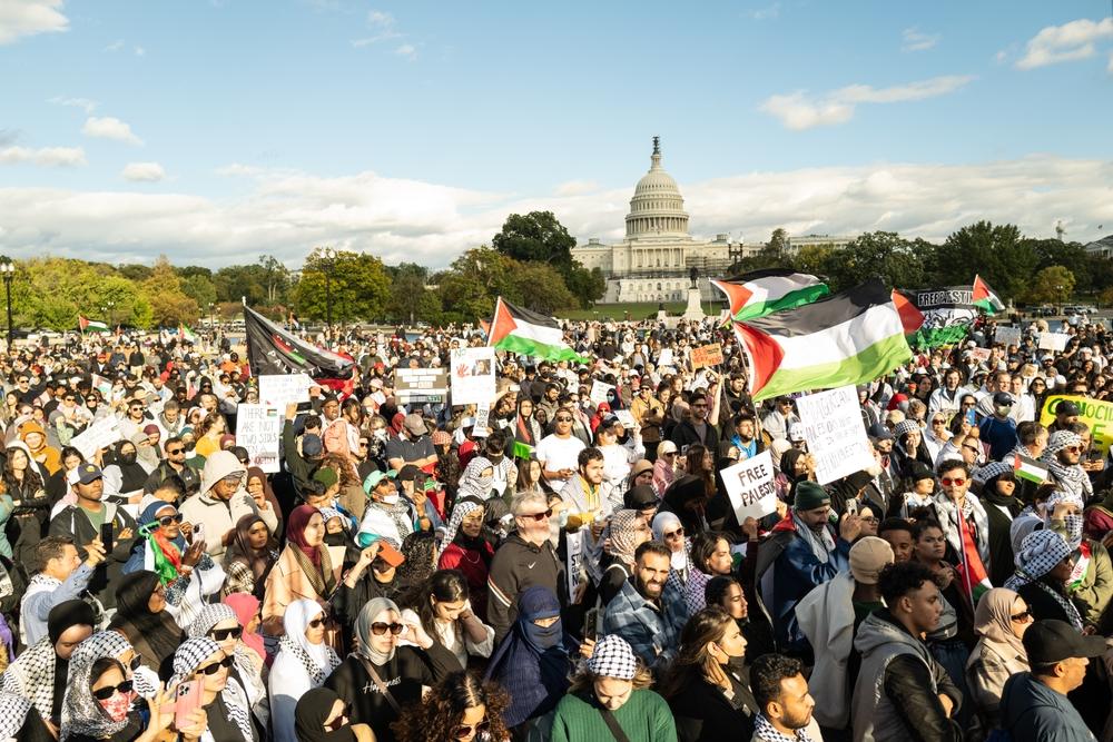 A large protest in Washington DC demanding a ceasefire in Gaza, with the Capitol Building in the background.