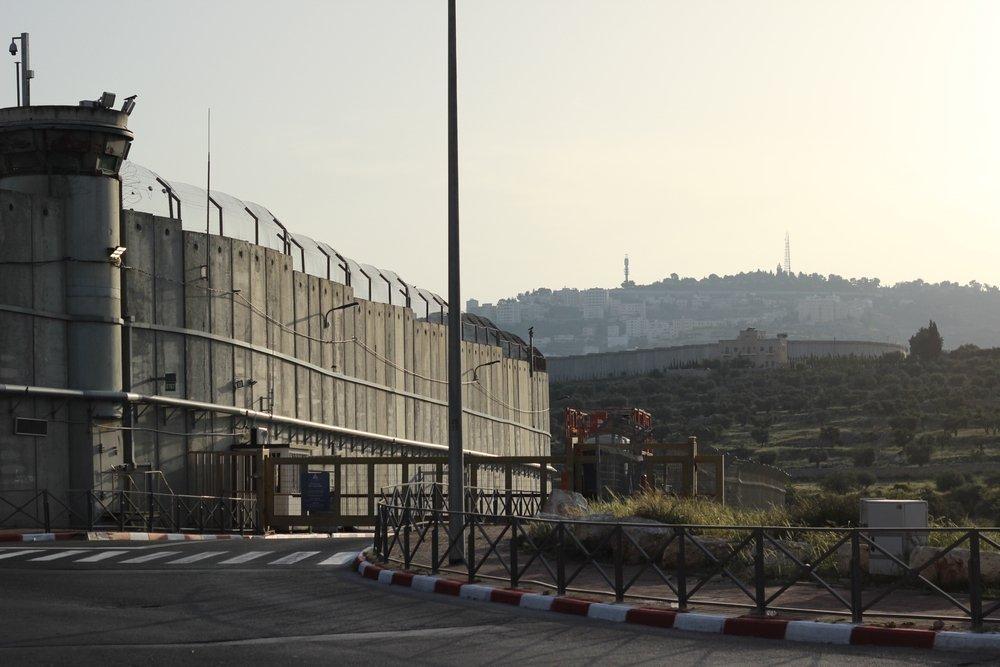 A view of Israel's apartheid wall and a military watch tower looming over the Palestinian city of Bethlehem in the occupied West Bank.
