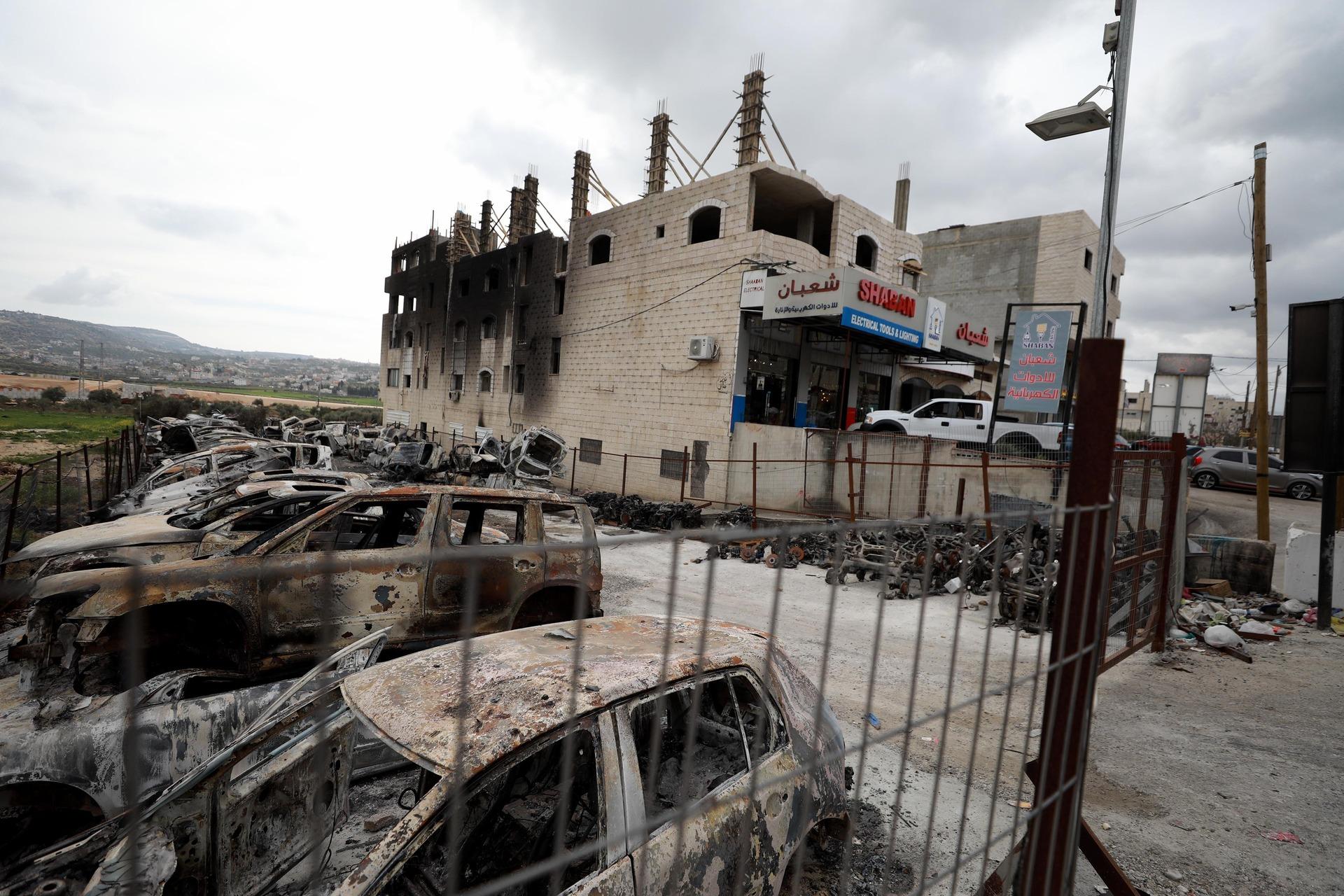 A view of a lot of destroyed and burned Palestinian cards and a burned buildings at the hands of an Israeli settler rampage in the village of Huwara, near Nablus, in the West Bank on March 7, 2023.