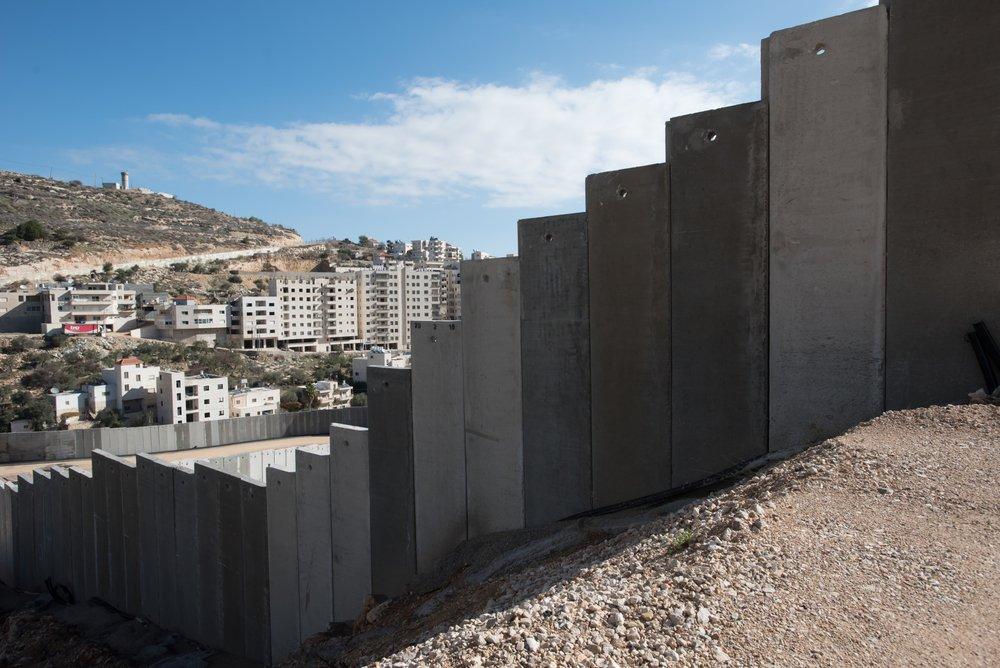 A view of Israel's apartheid wall cutting through the West Bank village of Beit Jala.