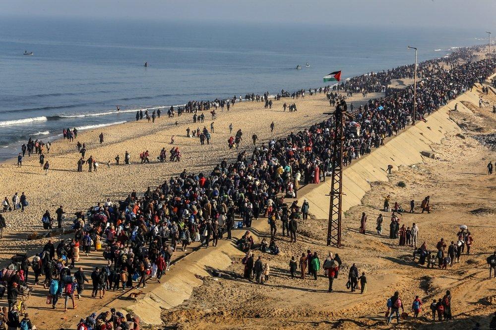 Masses of Palestinians walk home to northern Gaza along the Mediterranean shoreline following the short-lived January 2025 Gaza ceasefire.
