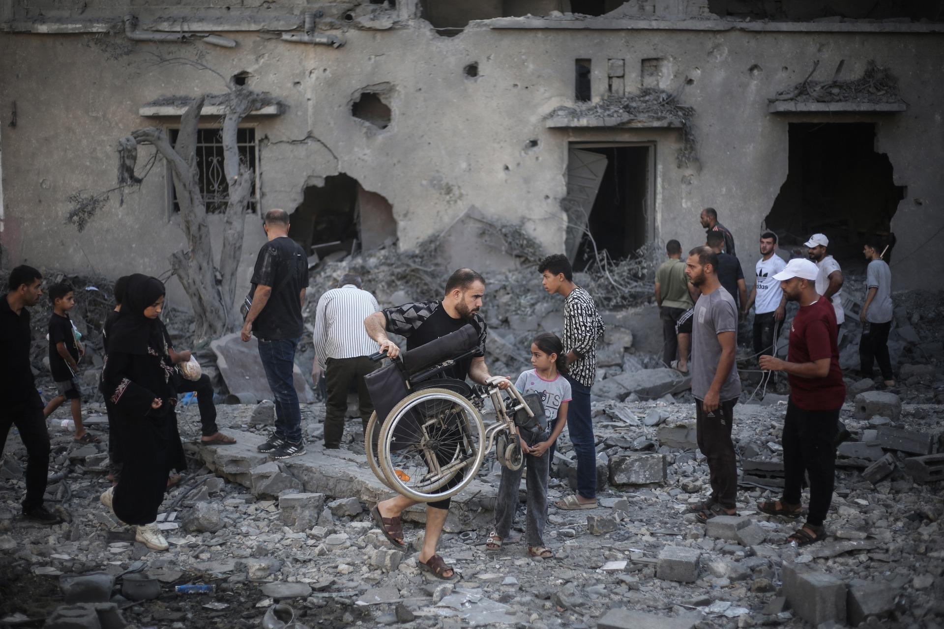 Palestinians inspect the damage to buildings in Deir Al-Balah, central Gaza, after an Israeli airstrike on July 29, 2026.