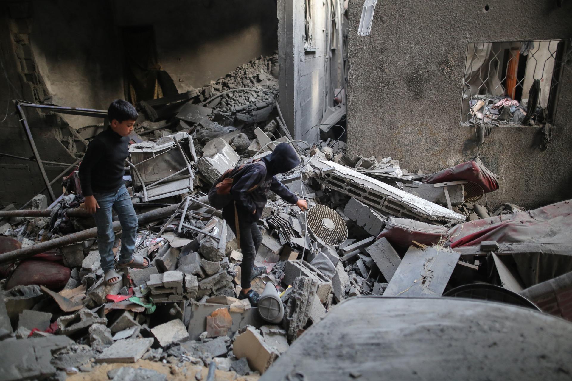 Palestinian children stand on the ruins of a building in the Shati refugee camp in Gaza after Israeli airstrikes earlier that morning. May 9, 2026.