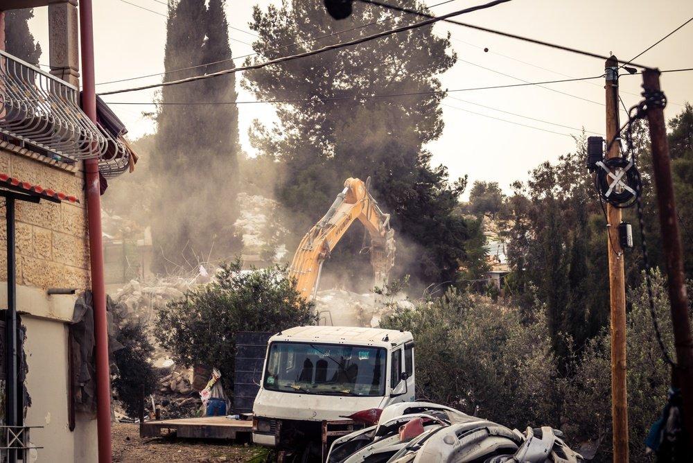 The Israeli military uses Hyundai construction machinery to destroy a home in the Palestinian village of Tarqiyah, in the Hebron District of the West Bank.
