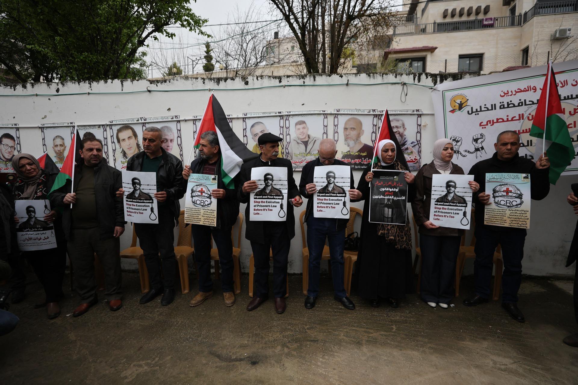 Palestinians protest Israel's death penalty law for Paelstinian prisoners outside of the Red Cross headquarters in Hebron. April 2, 2026.