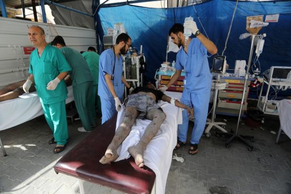 Medical team treats wounded patients at Al-Najjar Hospital after an Israeli attack. October 2023.