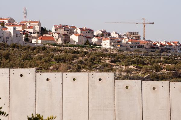 Image taken in Bethlehem behind Israel's apartheid wall showing the Israeli Gilo settlement under construction.
