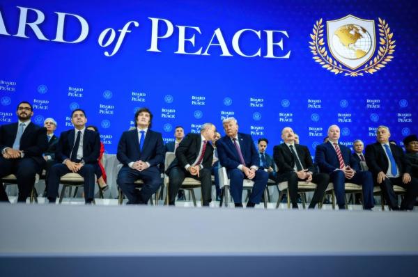 President Trump is seated on stage at the World Economic Forum (WEF) before a Board of Peace backdrop, he is joined by many world leaders including  Argentine President Javier Milei, Azerbaijani President Ilham Aliyev, and Hungarian Prime Minister Viktor Orban.