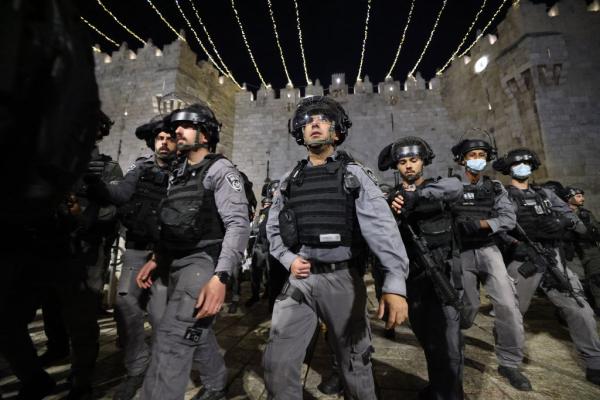 Large crowd of Israeli police surveil the Damascus Gate area in the Old City of Jerusalem in April 2021, during a period of heightened state and settler violence against Palestinians.