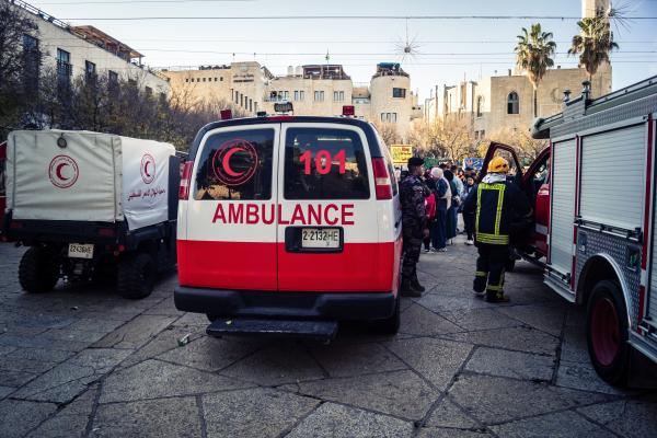 Palestine Red Crescent Society (PRCS) Ambulances and emergency teams near a Christmas market in Bethlehem.
