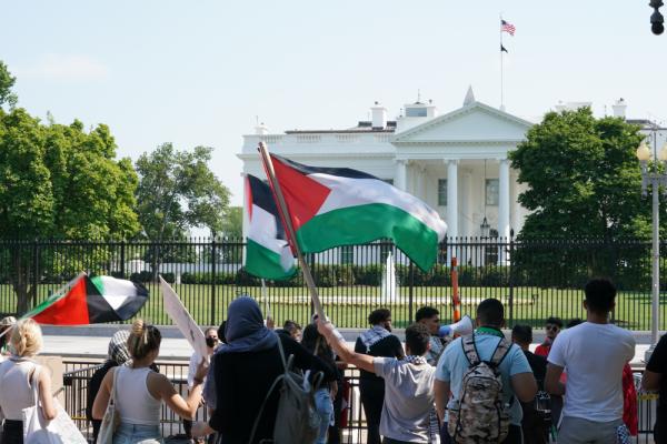 Protest against Israel's 2021 war on Gaza in front of the White House. One protestor waves a Palestinian flag.