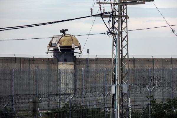 View of the concrete fall, fencing, and watchtower on the Israel-Gaza border as viewed from the Israeli kibbutz Netiv HaAsara. February 2023.
