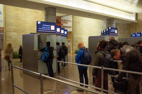 Travelers arrive at Ben Gurion Airport in Tel Aviv.