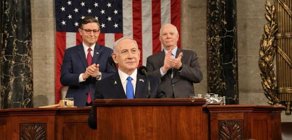 Netanyahu addresses a joint session of Congress. Behind him: Speaker of the House Mike Johnson, who presided over the session, and Senator Ben Cardin representing the Senate.