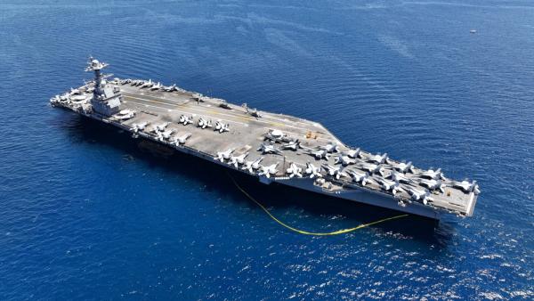 Aerial view of USS Gerald R. Ford aircraft carrier at sea.