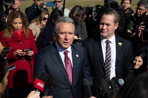 US National Security Advisor Michael Waltz stands beside Middle East Envoy Steve Witkoff as the latter addresses the media.