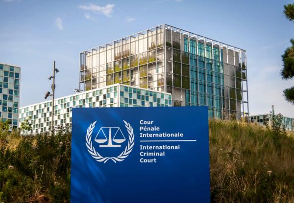 Image of the building exterior and sign of the International Criminal Court (ICC).