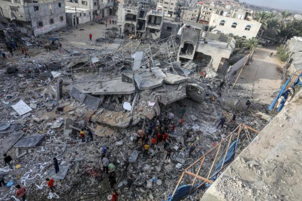Aerial view of Palestinians inspecting the damage to their home after an Israeli airstrike on Rafah. November 11, 2023.