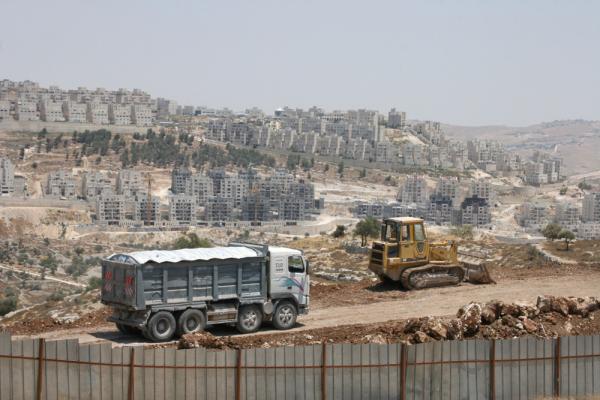 Israeli construction vehicles move through the infamous Maale Adumim settlement in the West Bank.