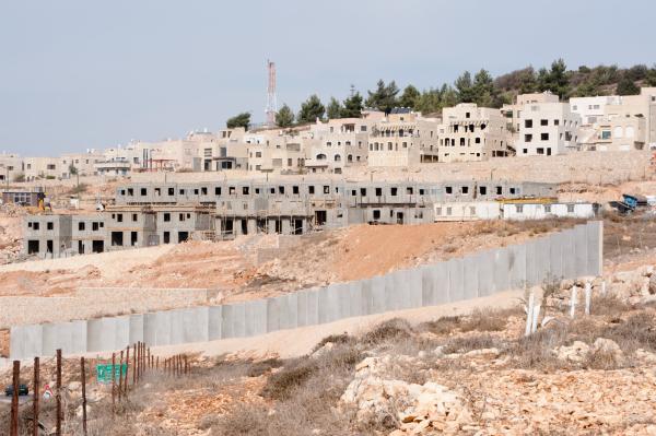 Process of construction of the Gilo Settlement in the Jerusalem Municipality with Israel's apartheid wall in view, 2010.