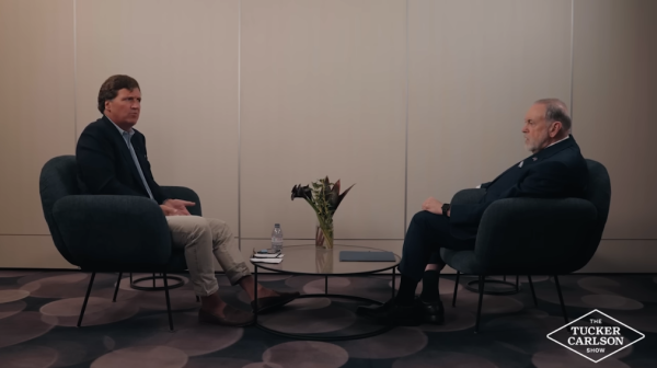 Mike Huckabee sits with Tucker Carlson for an interview.