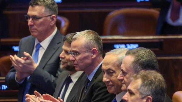 Benjamin Netanyahu, Yariv Levin, Bezalel Smotrich, Gideon Sa'ar and other key officials attend a speech at the Knesset.