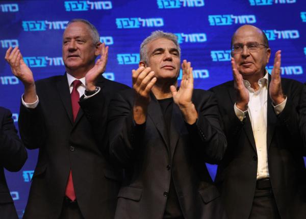 Benny Gantz, Yair Lapid, and Moshe "Bogie" Ya'alon, leaders of Israel's Blue and White Party, at a rally in Tel Aviv.