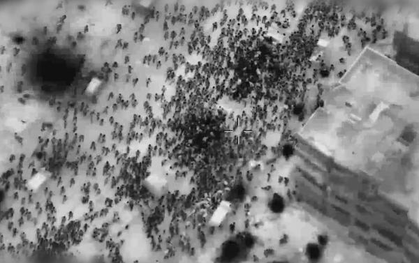 Screenshot of Israel's aerial targeting of a large crowd of Palestinians waiting to receive aid in Gaza City on February 29, 2024.