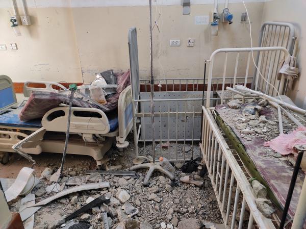 A view of the destroyed neonatal intensive care unit (NICU) of Kamal Adwan Hospital, showing destroyed cribs and medical equipment.