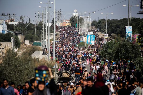 A massive crowd of Palestinians displaced from Gaza City walk along Salah al-Din Street with their belongings as they flee to the southern half of the Gaza Strip.