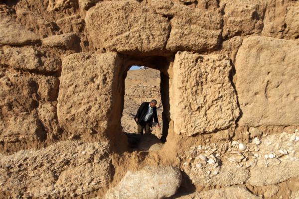 A Palestinian worker is seen through the Anthedon Harbor, or al-Blakhiyah, as he inspects the ancient archaeological site.
