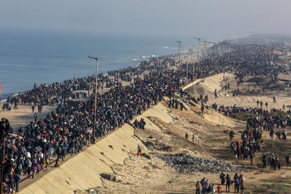 Massive crowds of displaced Palestinians walk from southern to northern Gaza along the Mediterranean shoreline.
